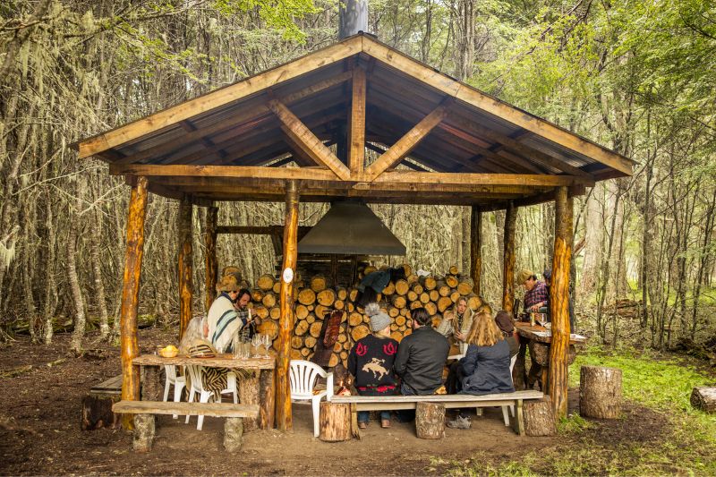 Group of people in a wooden hut in Tierra del Fuego, Patagonia